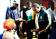 Former president Kgalema Motlante, right, and ANC Gauteng chairman Paul Mashative, centre on the campaign trail in Dobsonville.