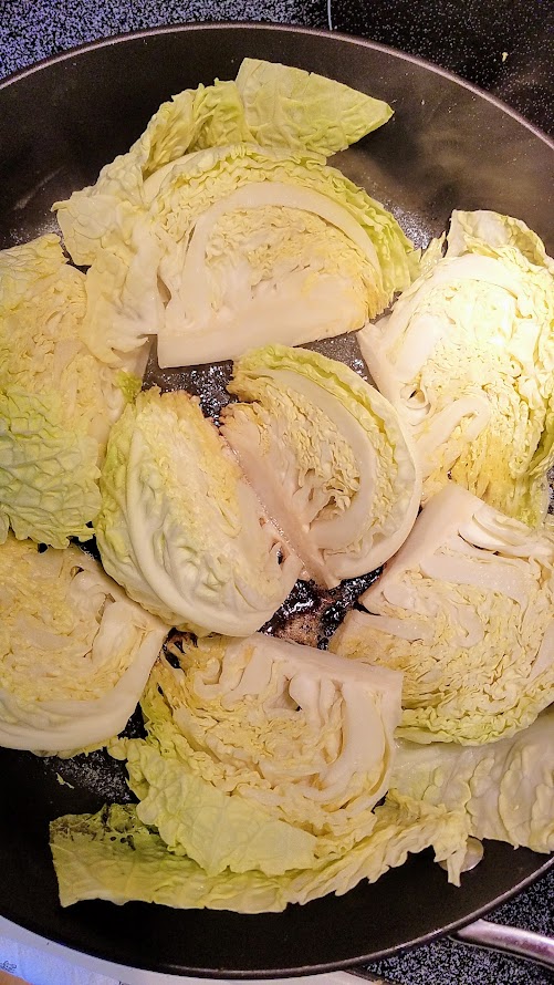 Cabbage getting browned in the pan for a Creamed Cabbage Recipe