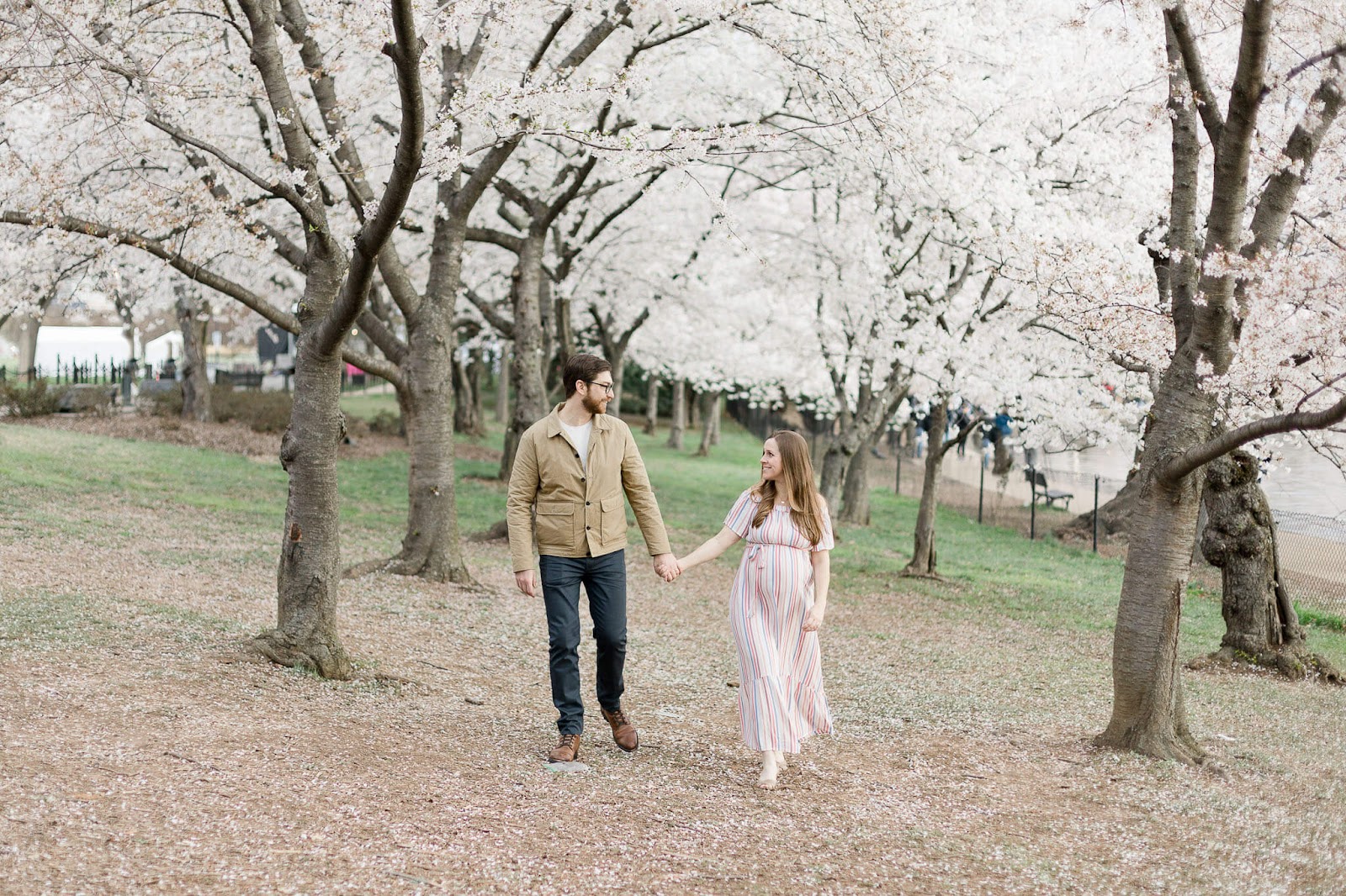 couple holding hands in the park