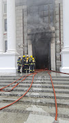 Firefighting efforts to contain the blaze at parliament in Cape Town