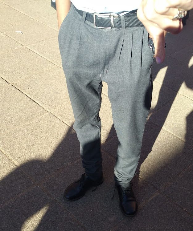 One of the pupils wearing the skinny school pants.