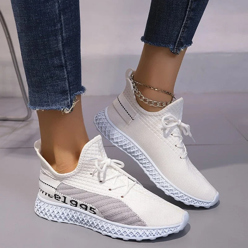 Zapatillas deportivas de punto volador para mujer con malla de encaje y boca baja ideales para correr y actividades deportivas.