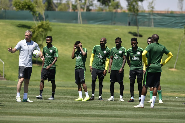 South African national mens soccer team coach Stuart Baxter with Thulani Seraro and Hlompho Kekana during the South African national mens soccer team training session at Steyn City School on November 13, 2018 in Johannesburg, South Africa.