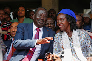 Kenya's Opposition leader and presidential candidate Raila Odinga chats with Martha Karua, his newly declared running mate, during the 'Azimio la Umoja' (Declaration of Unity) rally, at the Kenyatta International Convention Centre (KICC) Nairobi, Kenya May 16, 2022.