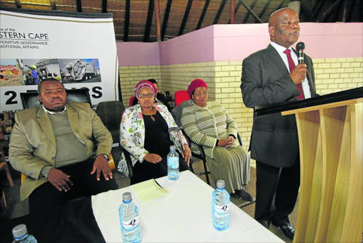 TAKING NOTE: Cogta MEC Fikile Xasa warns royals that they will be jailed if they break the new law regulating traditional initiation. Xasa was at Nyandeni Great Place near Libode this week. Here he is with Western Mpondoland King Ndamase Ndamase, left, his wife Queen Tina Madosini Ndamase and his mother, Queen Mother Bhongolwethu Ndamase Picture: LULAMILE FENI