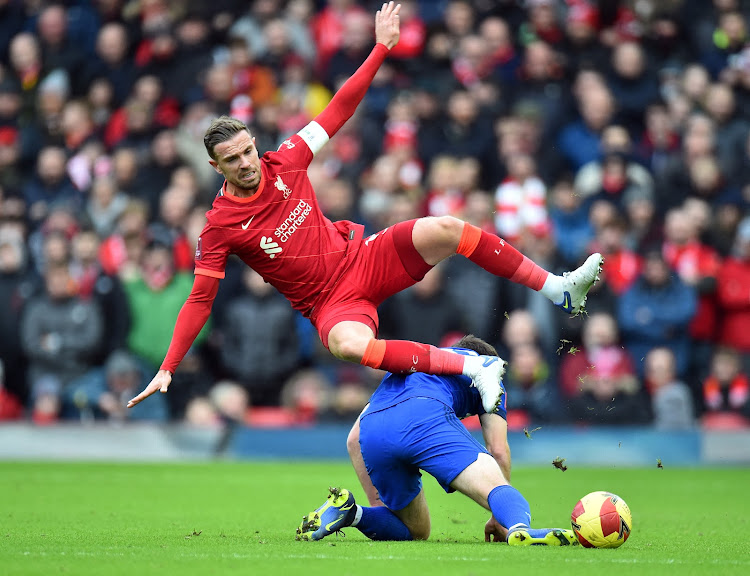 Cardiff City's Mark Harris in action with Liverpool's Jordan Henderson