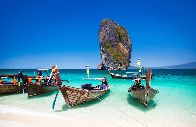 Boat on the beach at Phuket Island, Tourist attraction in Thailand Phuket is an international magnet for beach lovers and serious divers in the Andaman Sea.