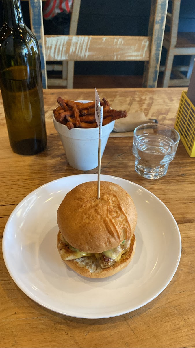 grilled chicken burger on gf bun with cheddar cheese and avocado, sweet potato fries