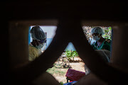 Health workers seen here last month administering vaccines to nurses and doctors at Chirau Village Clinic in Zvimba Rural District near Chinhoyi, Zimbabwe.