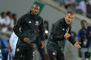 Orlando Pirates' head coach Milutin Sredojevic (R) and his assistant Rhulani Mokwena (L) during the Telkom Knockout quarter final match against Polokwane City at Orlando Stadium on November 04, 2017 in Johannesburg, South Africa. 