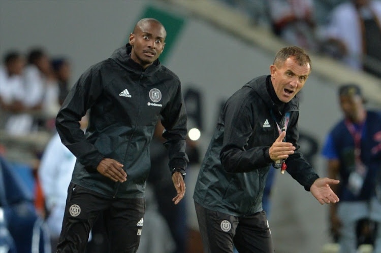 Orlando Pirates' head coach Milutin Sredojevic (R) and his assistant Rhulani Mokwena (L) during the Telkom Knockout quarter final match against Polokwane City at Orlando Stadium on November 04, 2017 in Johannesburg, South Africa.