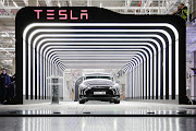 A new Tesla vehicle is seen during the official opening of the carmaker's new manufacturing plant near Gruenheide, Germany.