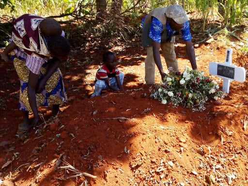 Parents of the deceased girl at her grave site. /KNA