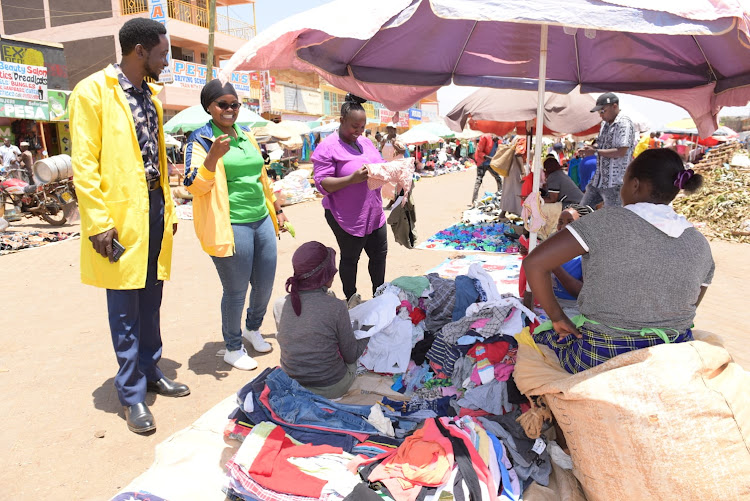 Kirinyaga ounty officials interact with second-hand traders during a revenue sensitisation campaign