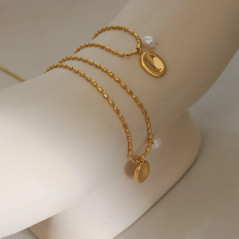 Mode titanium stalen ketting met ovale parel, niche merk. Verfijn je look met deze stijlvolle ketting, perfect voor dagelijks gebruik en speciale gelegenheden.