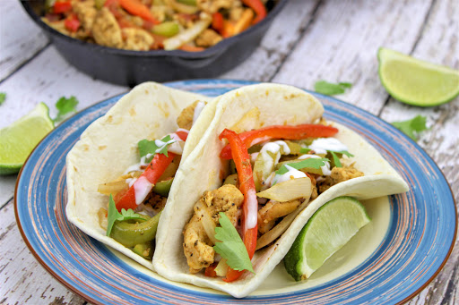 Oven fajita bake in tortilla shells.