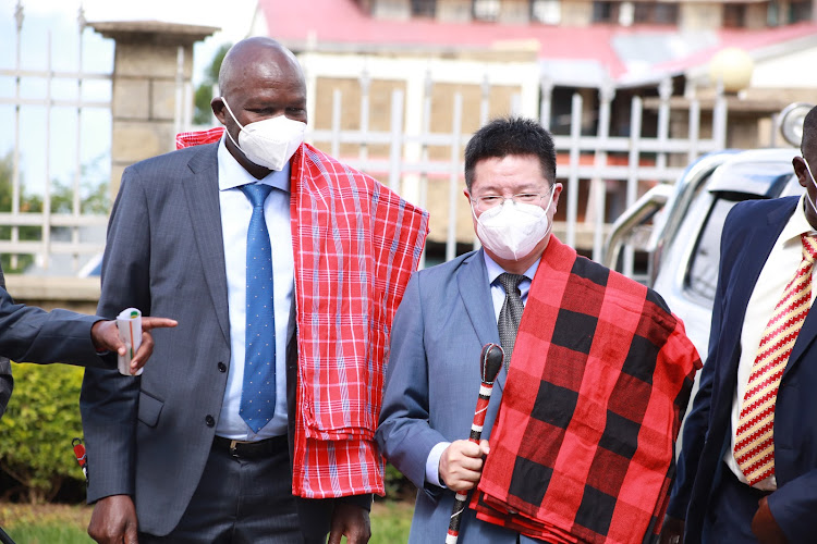 Baringo Governor Stanley Kiptis with Chinese investor Williams Chin after signing aloe-vera MoU on Thursday.