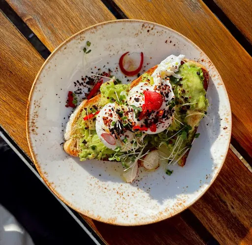 Two Poached Eggs On Avocado On Sourdough