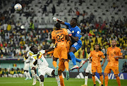 Senegal's Edouard Mendy and Idrissa Gana Gueye in action with Netherlands' Denzel Dumfries.