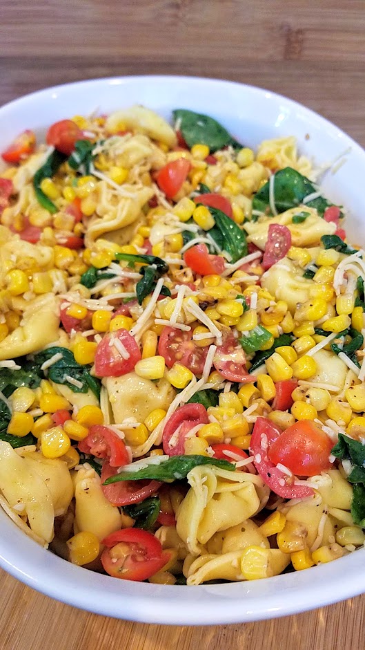 Tortellini Corn and Tomatoes Salad recipe, an easy summer recipe that takes advantage of the fresh taste of summer corn while its sweet and heirloom tomatoes at their juiciest and is perfect for a picnic, potluck, and can be served cold or room temperature