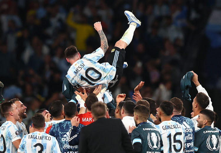 Argentina's Lionel Messi celebrates with teammates after winning the Finalissima