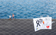 A sign placed on a fence in memory of the missing girls in the Canary Islands is seen in Santa Cruz de Tenerife, Spain, on June 11 2021. 