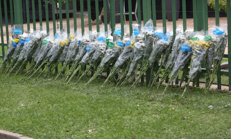 Bouquets of flowers sticking out by the lawns near the entrance of the Thrive Church in Boksburg on Thursday afternoon, where a funeral service was held for four siblings who were killed following the explosion of a gas tanker on December 24.