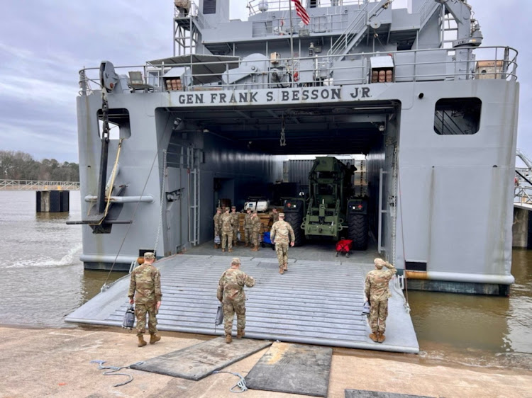 Personnel board the U.S. Army Vessel (USAV) General Frank S. Besson (LSV-1) from the 7th Transportation Brigade (Expeditionary), 3rd Expeditionary Sustainment Command, XVIII Airborne Corps as it departs en route to the Eastern Mediterranean after President Biden announced the U.S. would provide humanitarian assistance to Gaza by sea, at Joint Base Langley-Eustis, Virginia, United States, March 9, 2024.