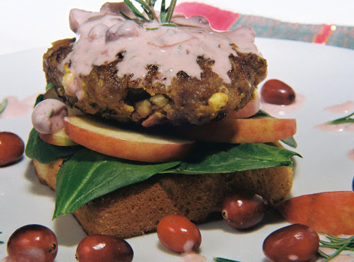 Cranberries, apple, pork, on cranberry orange toast, topped with cranberry rosemary creme fraiche. A sweet, savory, and spicy gourmet burger!