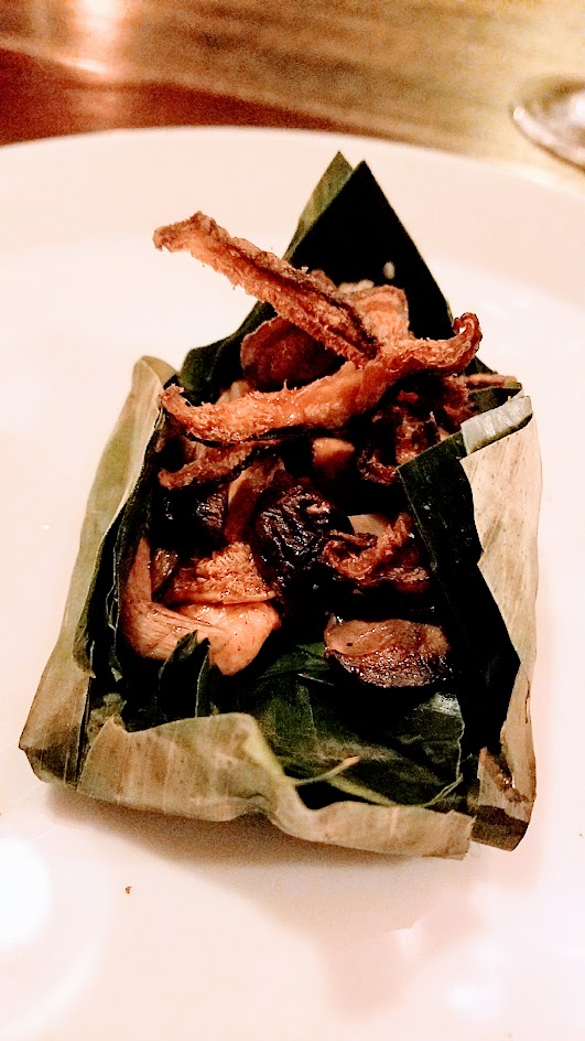 Twisted Filipino December Dinner by Carlo Lamagna Course 2: Pinais na Kabute, a nod to the traditional cooking in a banana leaf with this pocket filled with various mushrooms, bone marrow, and mushroom tar