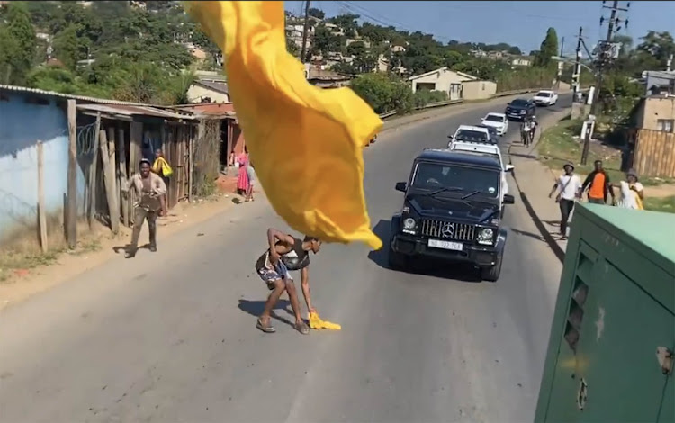 ANC t-shirts being thrown to residents from vehicles during an ANC campaign trail in Inanda, KwaZulu-Natal