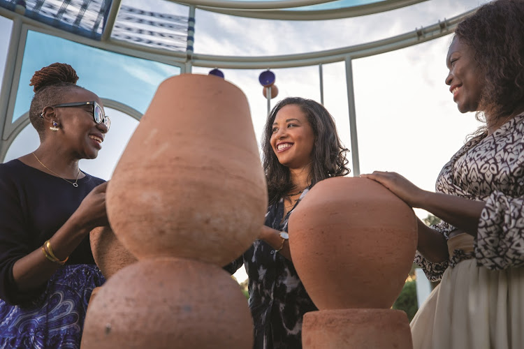 Artists Mpho Vackier, Candice Lawrence and Zizipho Poswa in the multi-sensory installation they created in collaboration with Sanlam Private Wealth.