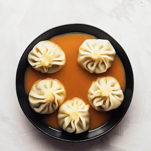 Paneer Momos [5 Pieces] With Tossed Into Sauce