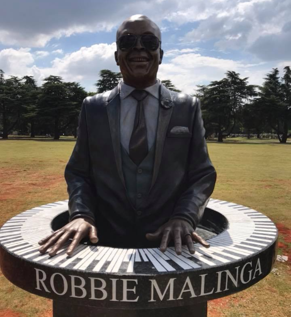 Robbie Malinga's family is happy with his redesigned tombstone.