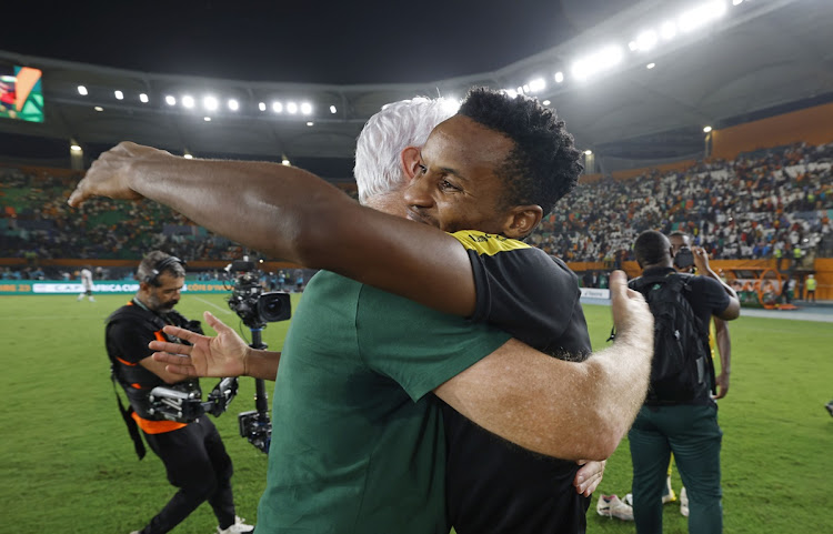 Bafana Bafana coach Hugo Broos embraces attacker Themba Zwane after their victory in the Africa Cup of Nations third place playoff match against Democratic Republic of the Congo at Stade Felix Houphouet-Boigny in Abidjan, Ivory Coast.