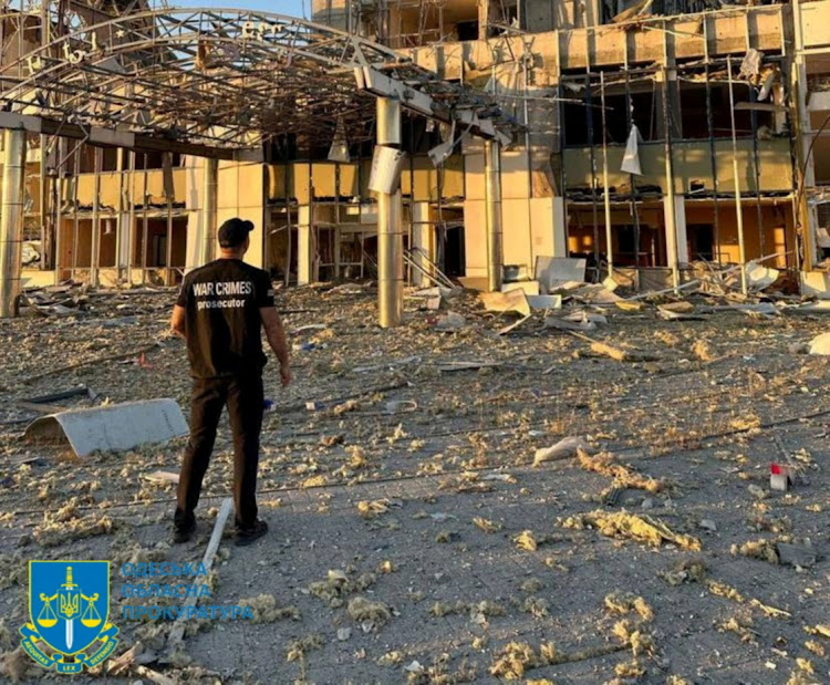 A member of Odesa regional prosecutor's office inspects damage following a Russian military attack in Odesa, Ukraine, September 25 2023. Picture: ODESA REGIONAL PROSECUTOR'S OFFICE/REUTERS