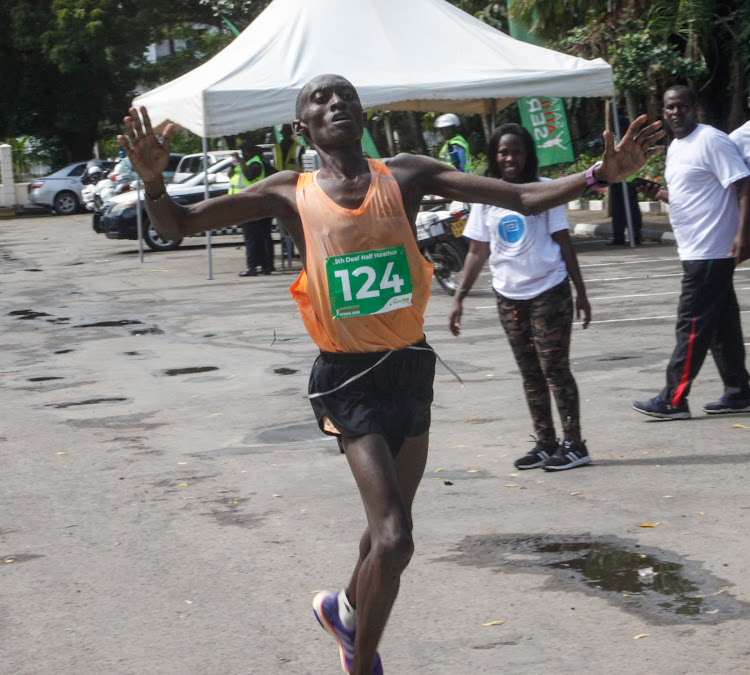 Martin Gachie crosses the finishing in a past event