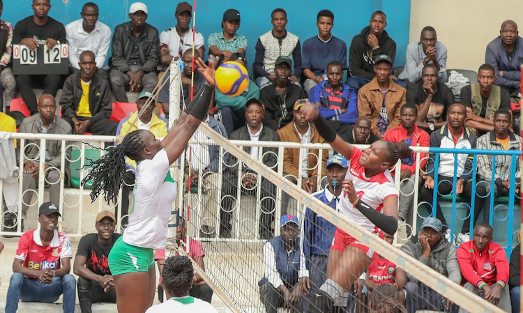 KCB's Mercy Moim blocks a shot from Kenya Piprline's Gladys Ekaru