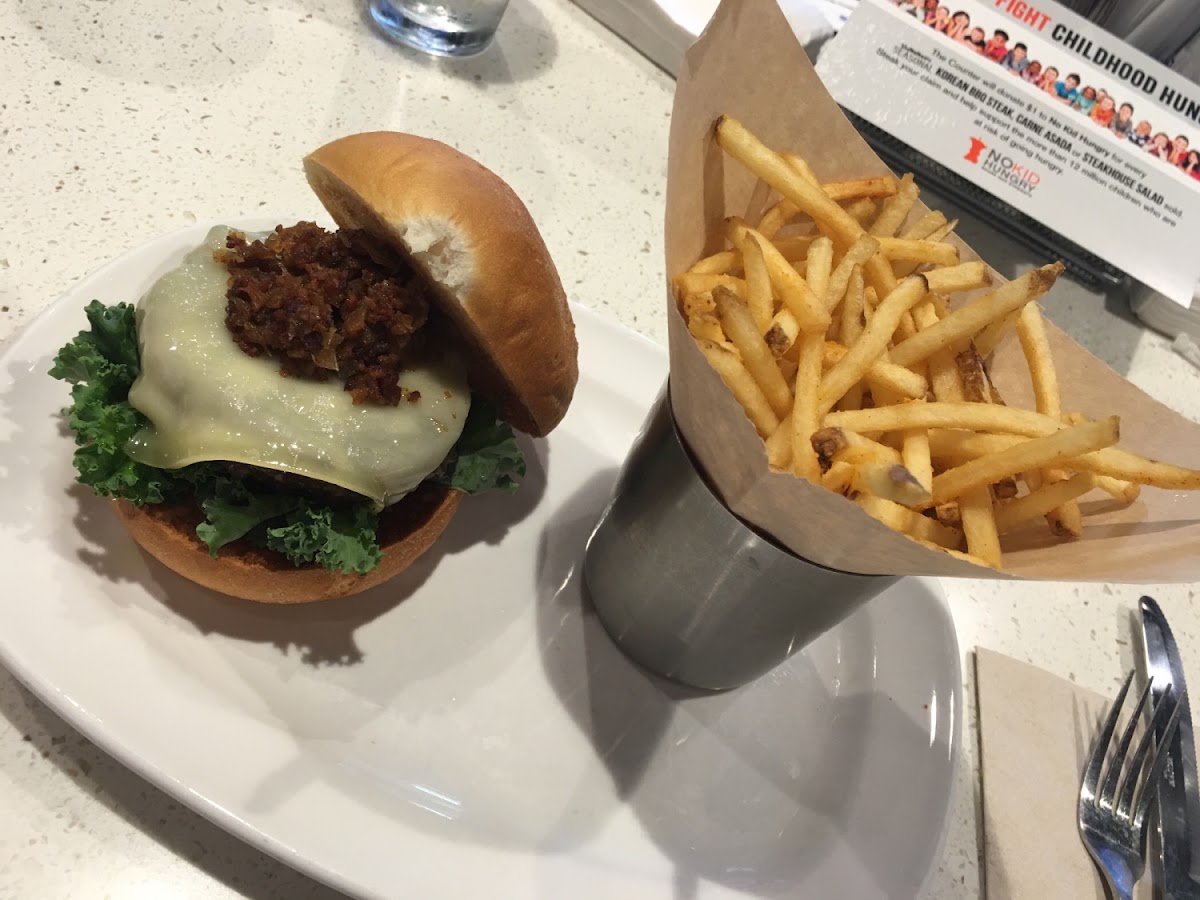 Beef burger topped with provolone, kale, and bacon onion marmalade  + shoestring fries