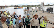 Zambian President Edgar Lungu leads his then-Botswana counterpart, Ian Khama (centre, hat in hands), during their tour of the Kazungula bridge construction site in this file photo.