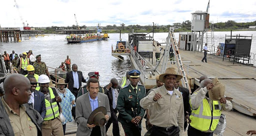 Zambian President Edgar Lungu leads his then-Botswana counterpart, Ian Khama (centre, hat in hands), during their tour of the Kazungula bridge construction site in this file photo.