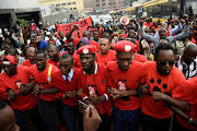 Ugandan musician turned politician Robert Kyagulanyi (C) leads activists during a demonstration against new taxes including a levy on access to social media platforms in Kampala on July 11. 