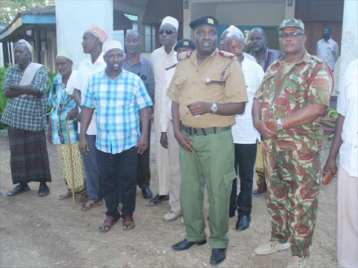 Garsen MP Ali Wario with Coast regional coordinator Bernard Jomo Lemparamai and other senior security officials with local leaders during the media briefing on Sunday evening./ALPHONCE GARI