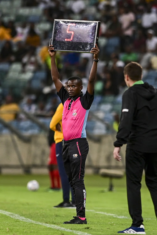 A PSL match official hoisting the extra time sign. According to Safa refereeing boss, additional time up to 10 minutes could be the norm in SA.