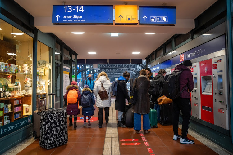 Passengers purchase train tickets from a vending machine at Hamburg Central Station in Hamburg, Germany, on Tuesday, March 15, 2022.