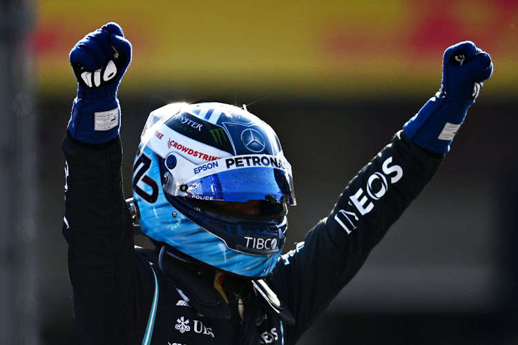 Pole position qualifier Valtteri Bottas celebrates in parc ferme during qualifying ahead of the F1 Grand Prix of Mexico at Autodromo Hermanos Rodriguez on November 06, 2021 in Mexico City, Mexico.