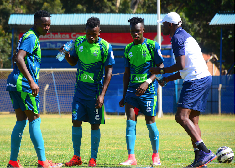 KCB assistant coach Sammy Omollo instructs Clinton Kisiavuki, Chrispinus Onyango and Victor Omondi during a recent league match