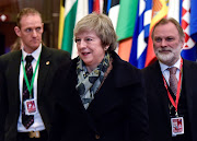 British Prime Minister Theresa May and Britain's Permanent Representative to the EU Tim Barrow leave after a European Union leaders summit in Brussels, Belgium December 14, 2018. 
