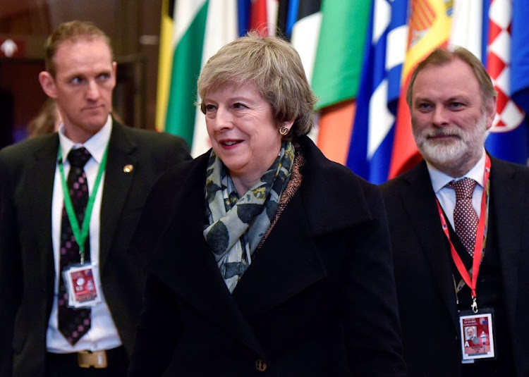 British Prime Minister Theresa May and Britain's Permanent Representative to the EU Tim Barrow leave after a European Union leaders summit in Brussels, Belgium December 14, 2018.