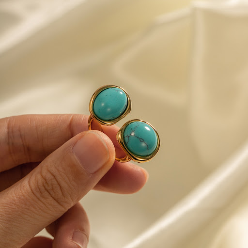 Title 7, Gold-plated stainless steel ring with inlaid na...